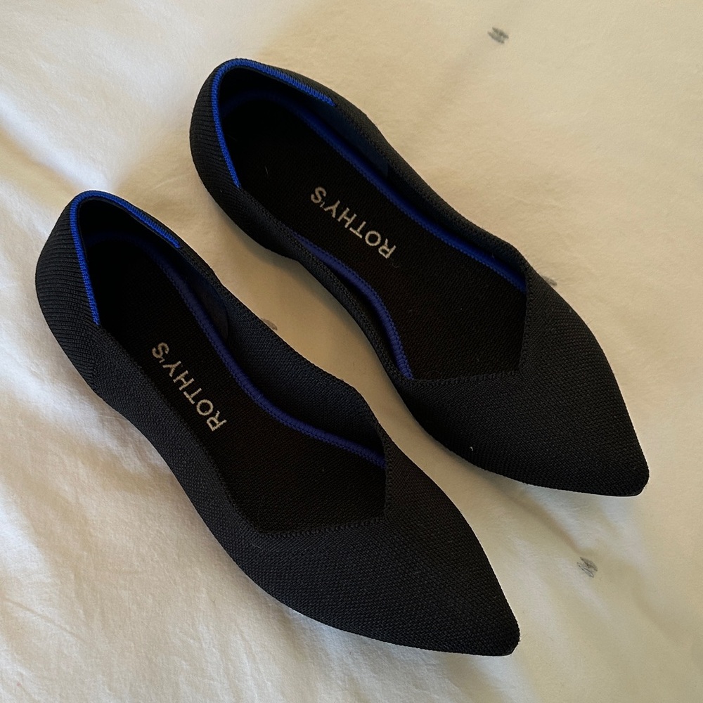 Rothy's Elegant Black Flats with Vibrant Blue Accent